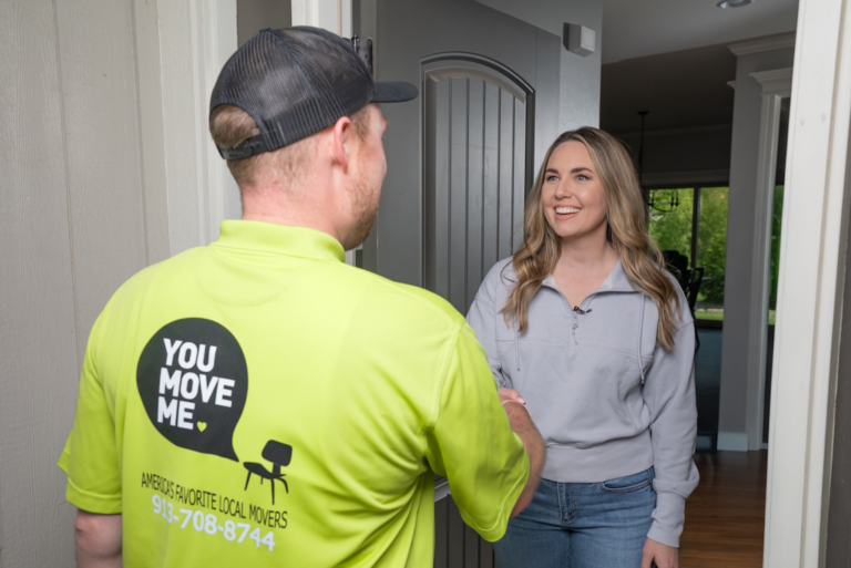 home owner shaking movers hand